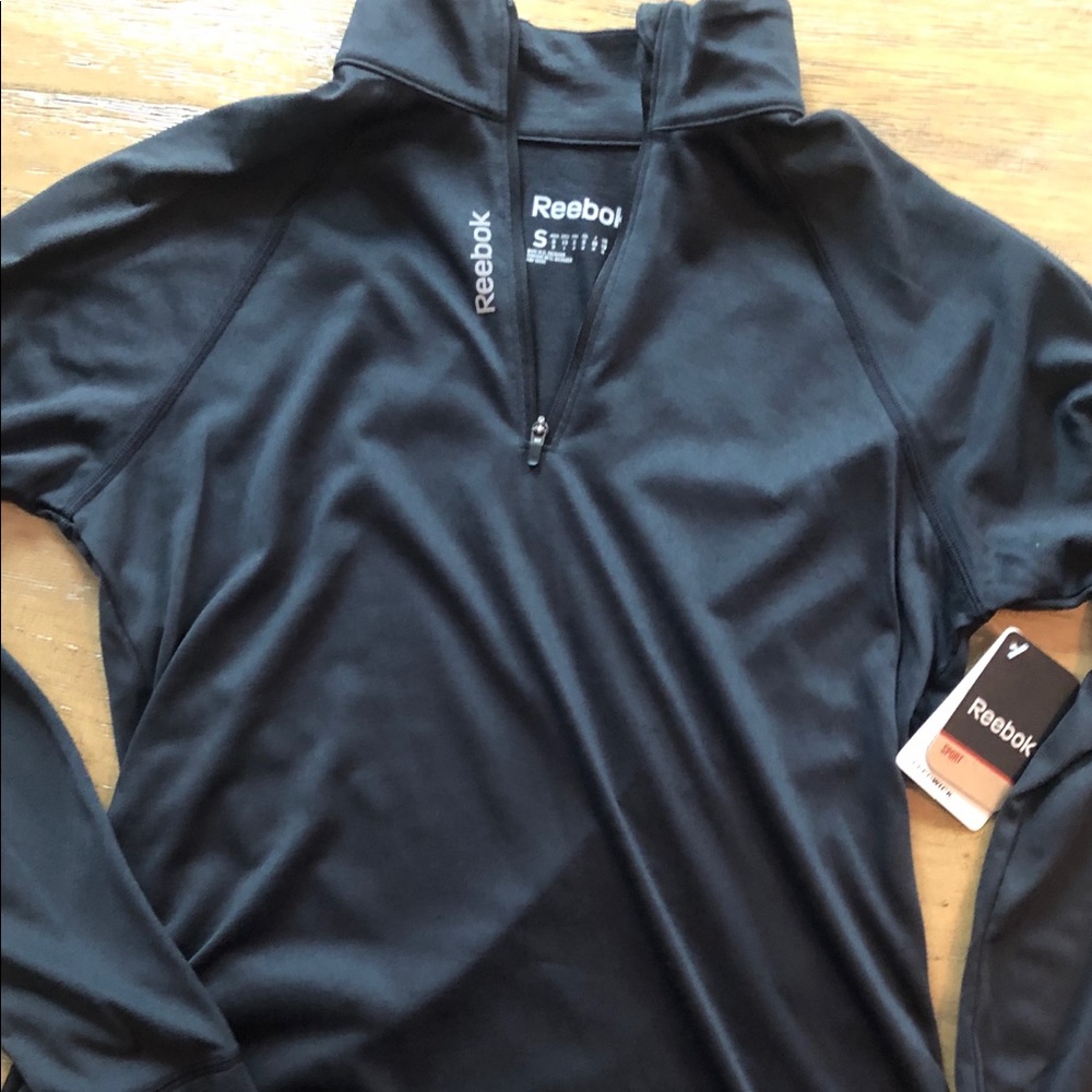 Reebok pull over. New with tags.